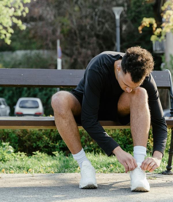A man focused on his exercise routine in a calm, well-lit space.