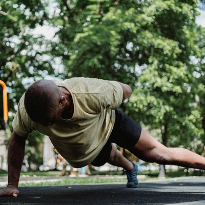 Man holding a core-stabilizing plank position.